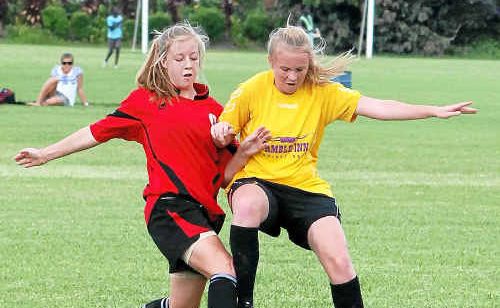 COFFS United’s Georgia Burt and Corindi-Red Rock’s Ellie Slater battle for possession on Saturday. COFFS United’s Georgia Burt and Corindi-Red Rock’s Ellie Slater battle for possession on Saturday.